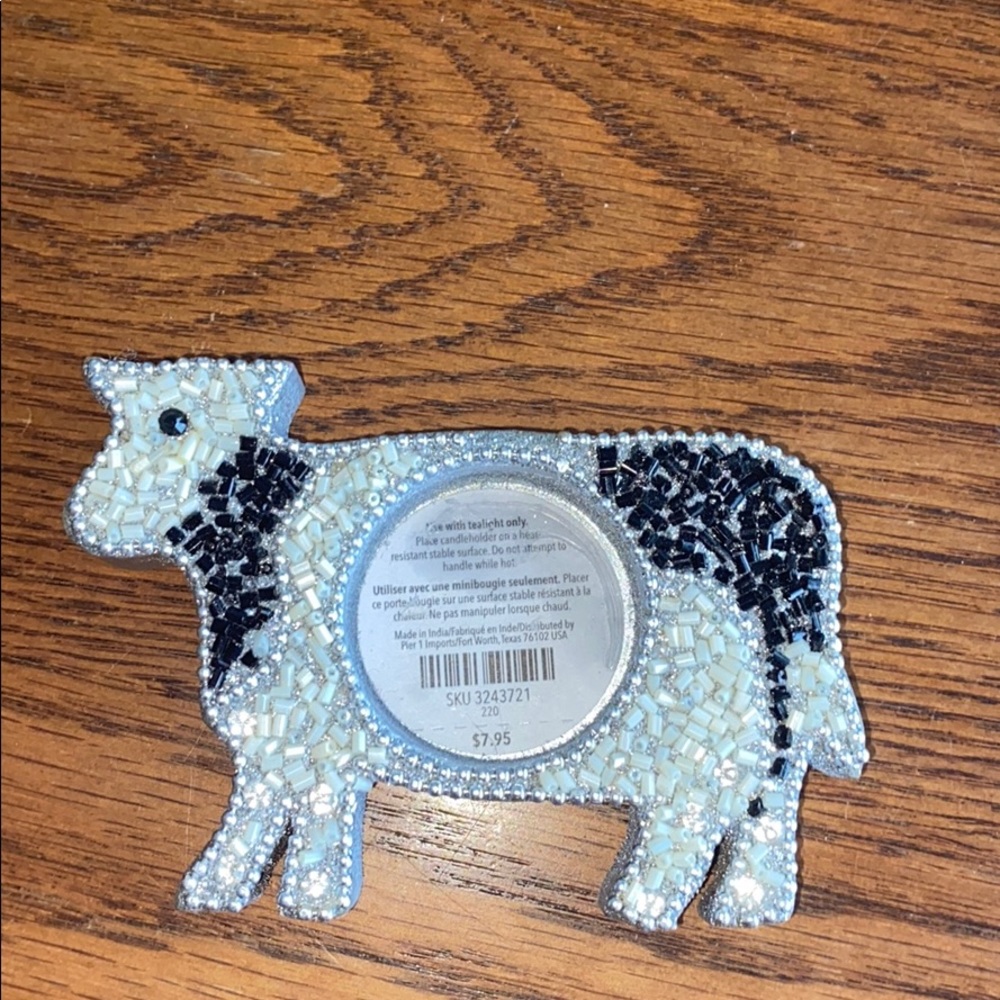 A cow candle holder